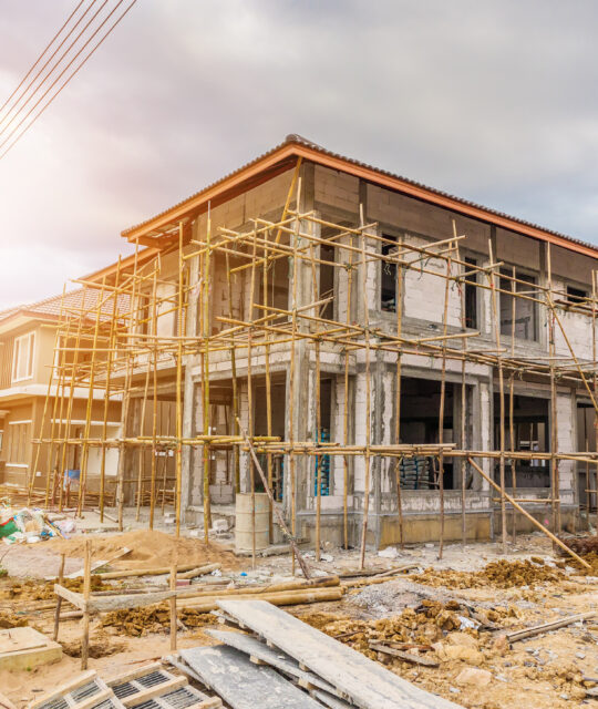 New house under construction at building site